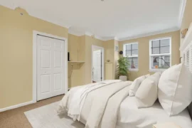 Bedroom with a bed and two windows