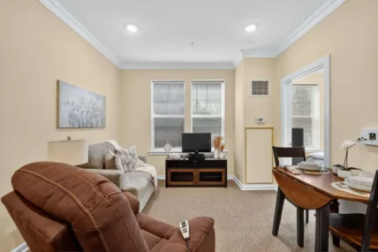 a living room with a dining area